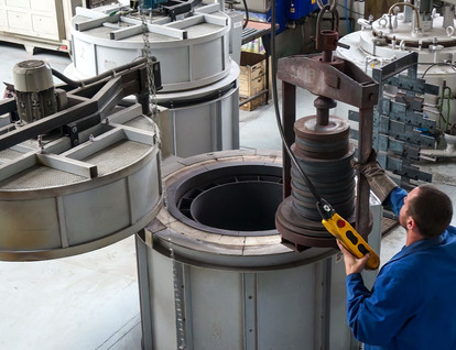 Metal plates being heat-treated in an industrial furnace