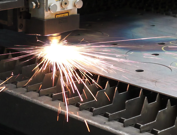 Laser machine cutting blade shapes from metal sheets